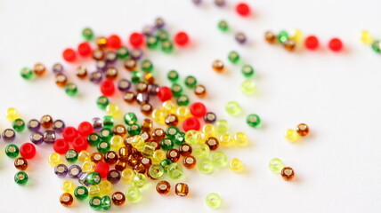 Glass beads mix isolated on white background. Different colors. 