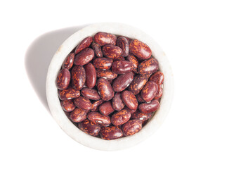 Top view of red beans in marble bowl isolated on white background.