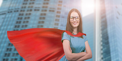 portrait of a beautiful young woman in a superhero cape
