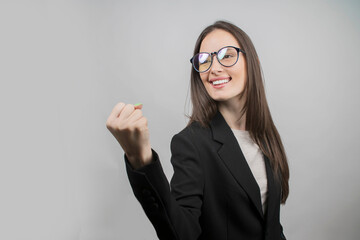 portrait of  a young female leader rejoices in her success