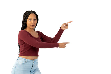 Young black woman with casual clothing in white background pointing to the right