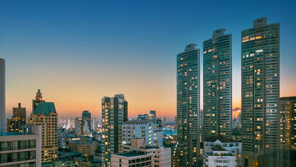 Scenery view night cityscape at sunset with skyscraper in Bangkok, Thailand.
