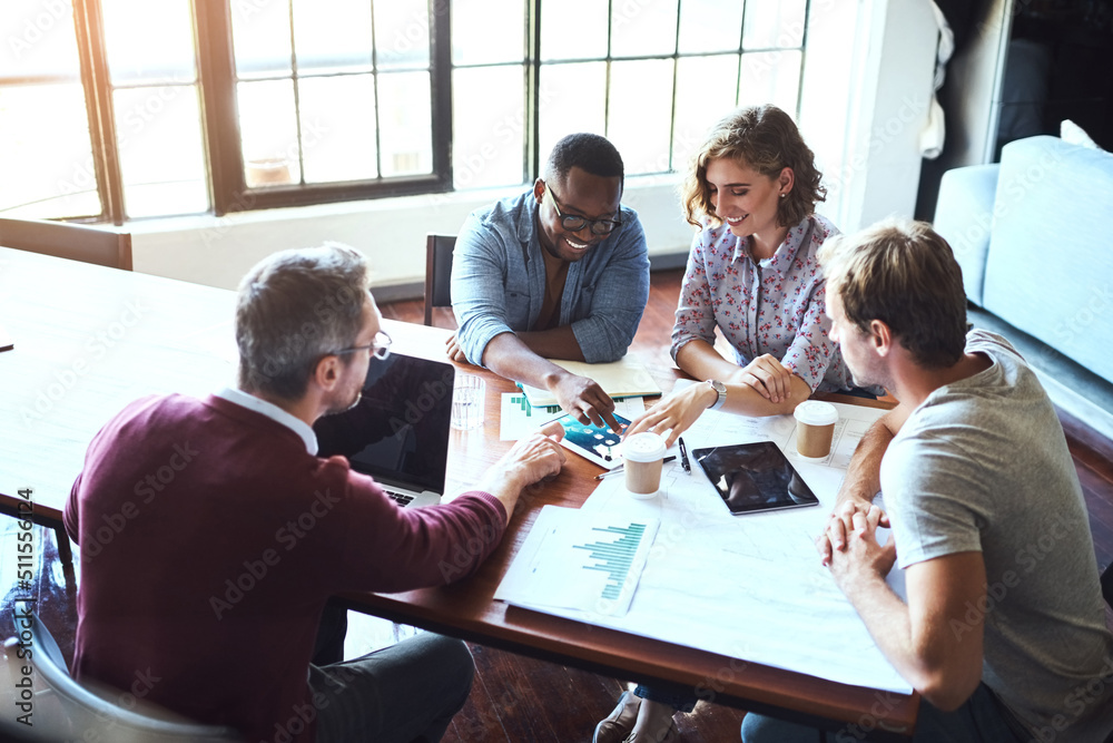 Poster theyre the team for the job. shot of a creative team having a brainstorming session in the boardroom