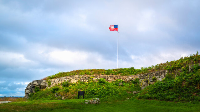 American flag waving against cloudy sky at Fort Griswold Battlefield State Park
