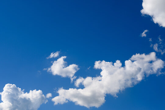 picturesque white clouds in a blue sky