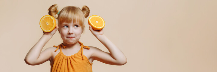 Banner little girl making herself ears out of oranges