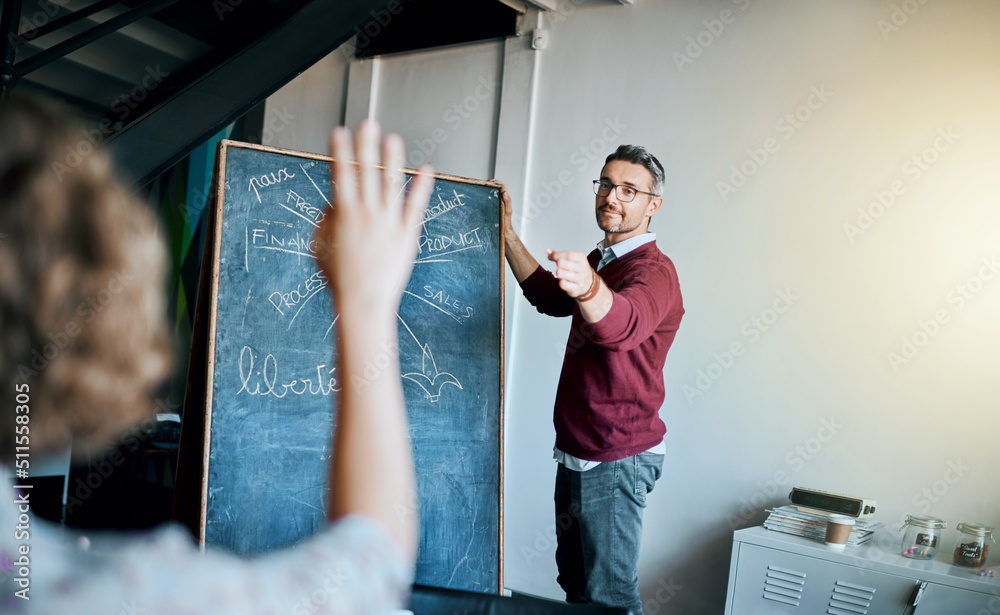 Aufkleber i have a question. shot of a creative business team having a meeting and discussing business related