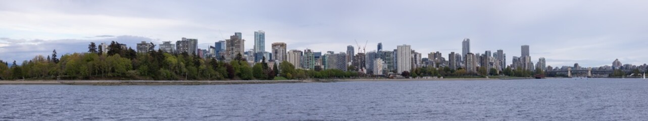 Modern City, Stanley Park, Buildings, beach and Burrard Bridge in False Creek on the West Coast of Pacific Ocean. Downtown Vancouver, British Columbia, Canada. Panoramic View