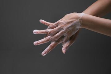 Lady washing hand rubbing with soap to prevent the spread of bacteria and virus. Personal hygiene...
