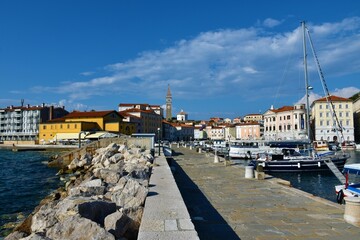 Piran, Slovenia - May 10 2022: View of Piran town from a pier, on the Adriatic coast in Slovenian Istria