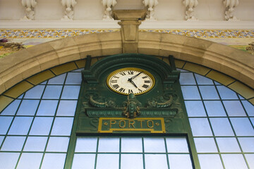 Old clock in Sao Bento railway station in Porto 