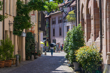 Fototapeta na wymiar Romantic alley at archiepiscopal ordinariate in the old town of Freiburg im Breisgau. Baden Wuerttemberg, Germany, Europe