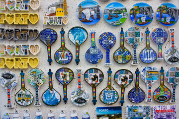 Different magnet souvenirs for sale at local store in Porto