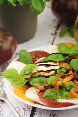 A plate with Italian salad caprese	