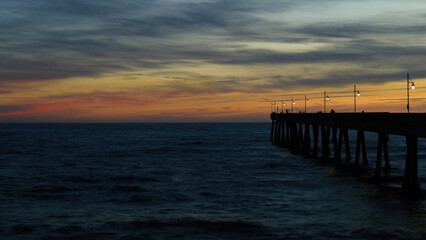 Fototapeta na wymiar Twilight Skies over Pacifica Municipal Pier. Pacifica, San Mateo County, California, USA.