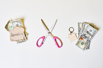 poor and rich concept with money on white background. Scissors and Money and home and just pennies