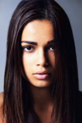 Her beauty is all natural. Shot of a beautiful young woman in the studio.