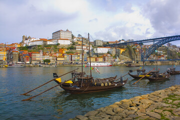 Old Traditional old boats with wine barrels on the waterfront of Porto
