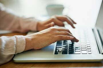 Planning for big success. Closeup shot of an unidentifiable businesswoman using a laptop in an office.