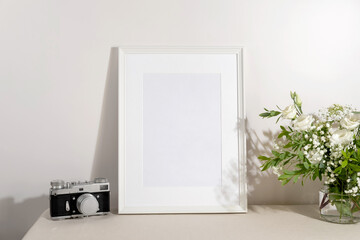 Blank frame mockup for artwork or print on white wall background.