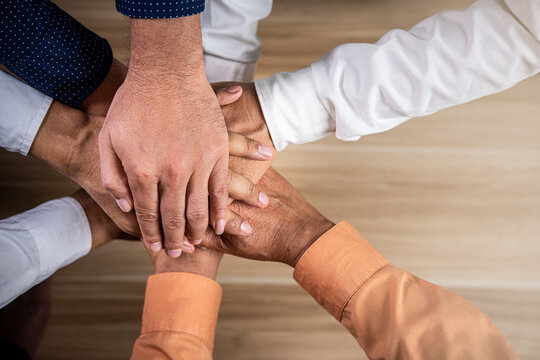 Hand of team business teamwork and leadership community young business people putting their hands together,Stack of hands,Volunteer charity work,Unity and teamwork concept.