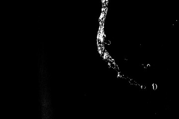 water splashes isolated on black background. white jets with drops