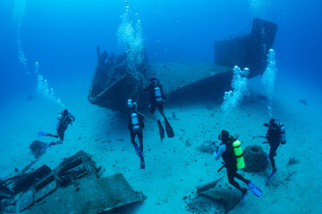 Divers on the wreck of the Carib Cargo off the Dutch Caribbean island of Sint Maarten