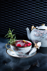 Delicious cocktail with alcohol served with garnish prepared by the bartender in the cocktail bar in dark colors