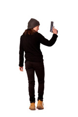Woman dressed in black holding a gun