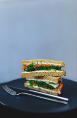 sandwiches on a black plate