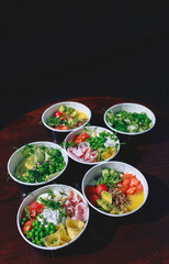 vegetables in black boxes, bowls