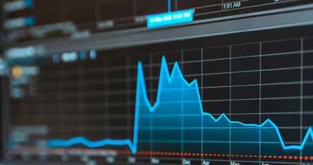 Daily trading prices on the online stock market graph showing on color screen.Daily investor's business everyday life.Banner,selective focus.