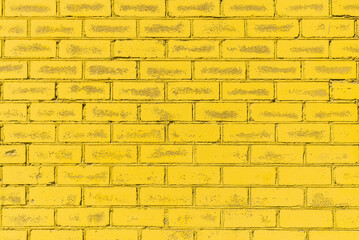 Yellow wall brick background texture photo.Background yellow brick wall.