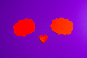 Red clouds,heart for Valentine's day concept.Communication red heart between two clouds. Purple,veri peri background.Place for your text. Copy space.