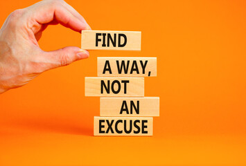 Find a way not excuse symbol. Concept words Find a way not an excuse on wooden blocks on a beautiful orange table orange background. Businessman hand. Business motivational and not excuse concept.