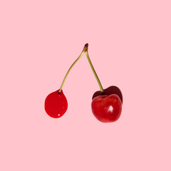 Cherry fruit minimal creative concept, pastel pink background. 