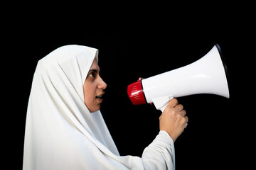 Arabic woman with hijab shouting through megaphone for Hajj in Mecca
