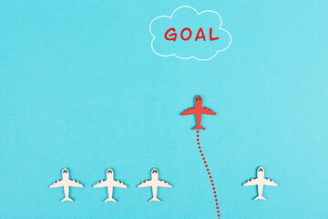 Red airplane is flying to his goal,  leadership, courage and winner concept, standing out from the...