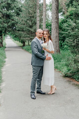 Fototapeta premium brides near the trees in nature