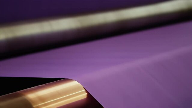 Roll of Purple Paper Spinning in Industrial Paper Mill Machine - Close Up - 4K