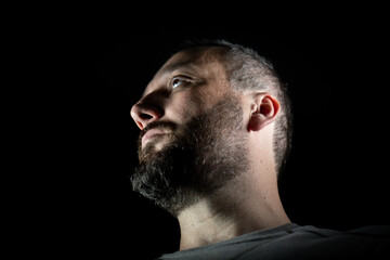 Obraz premium Portrait of 40 years old man on a black background. High quality photo