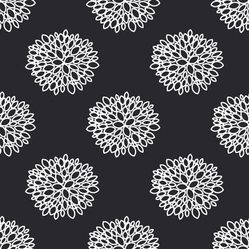 Abstract aster and chrysanthemum flowers are drawn with a white outline on a black background. Seamless floral pattern for decorative fabrics.