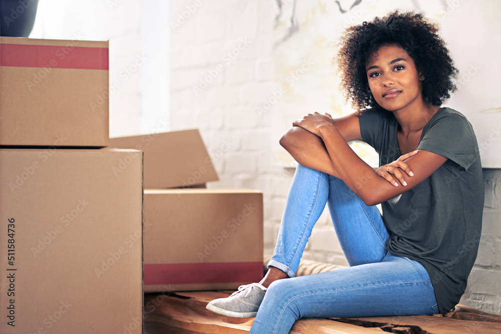 Canvas Prints Just taking a moment to reflect.... Shot of a young woman moving into her new house.