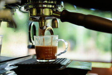 espresso machine pouring coffee