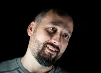 Obraz premium Portrait of 40 years old man on a black background. High quality photo