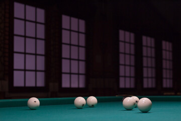 White russian billiard balls position on green game table