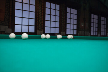 Russian billiards balls position on green game table cloth