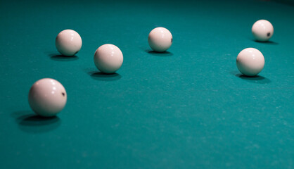 Close-up of Russian billiards game: balls on green table