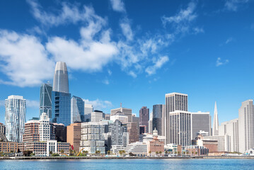 Boat level view of San Francisco, California downtown district and its skyscrapers and San...