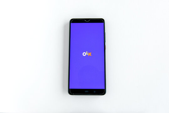 OLX app on smartphone screen on white background. Iju&iacute;, Brazil-June, 2022